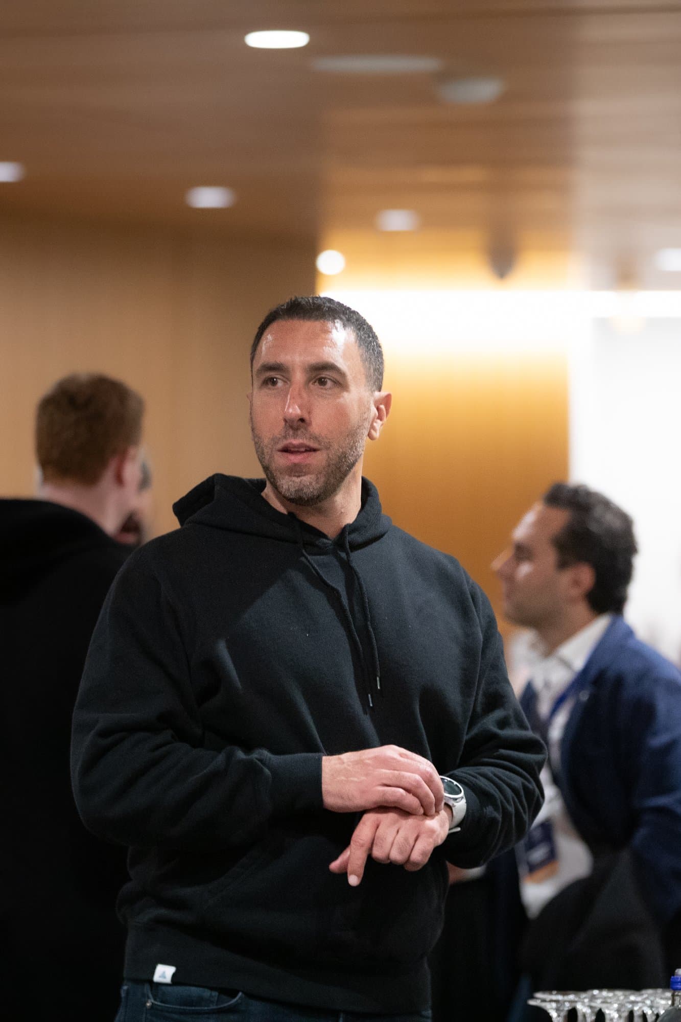 Ross in conversation at a networking event