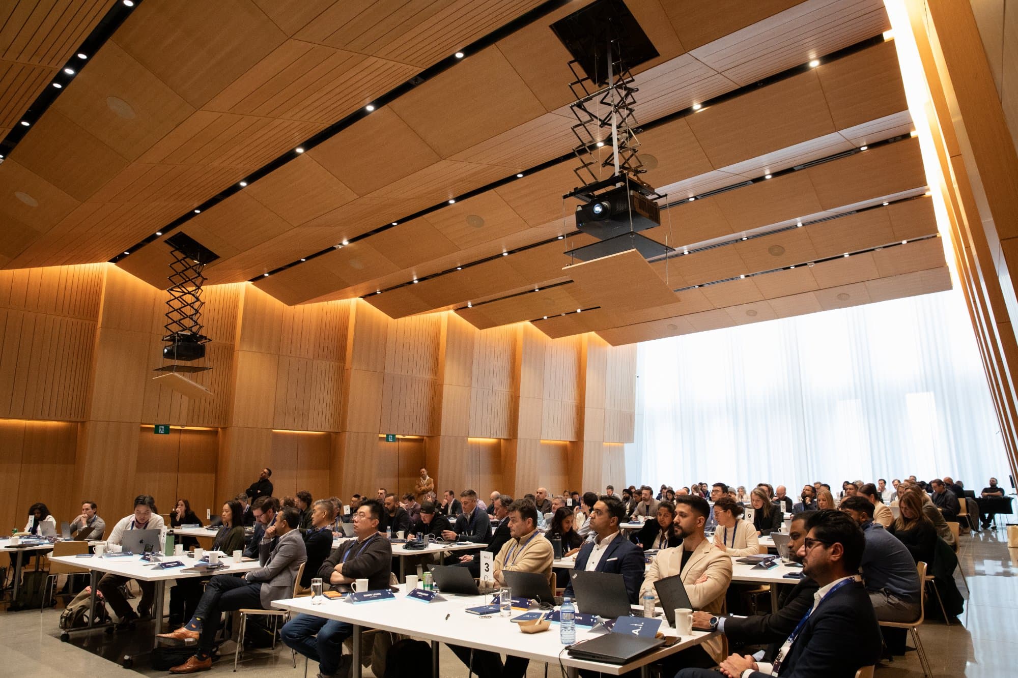 Business leaders engaged in an Aspiro AI workshop at a premier venue