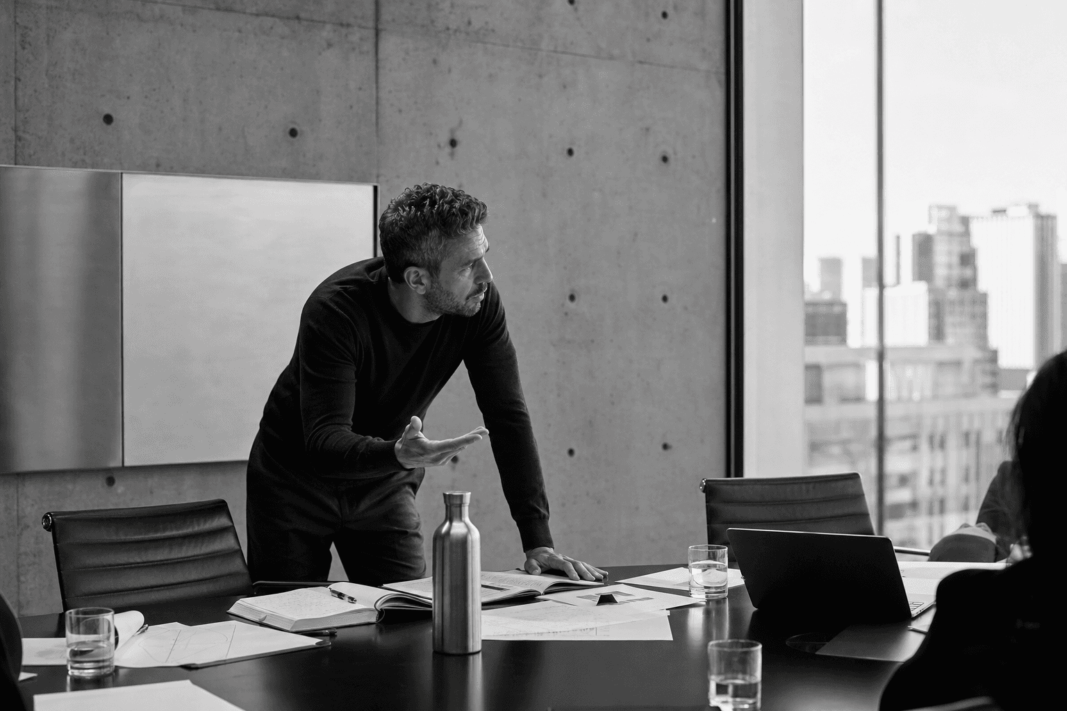 Mid-market leadership team reviewing AI decision velocity framework on a whiteboard, illustrating AI competitive advantage mid-market strategy